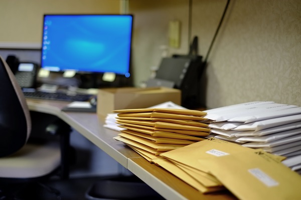 Mail Piling Up on a Desk